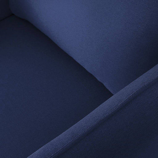 Dettaglio tessuto blu in primo piano, imbottitura morbida e resistente, perfetta per poltrona di design contemporaneo.