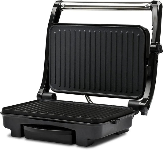 Bistecchiera elettrica Girmi 1500W con piastre antiaderenti 27x17 cm aperta, perfetta per cotture uniformi e senza grassi.