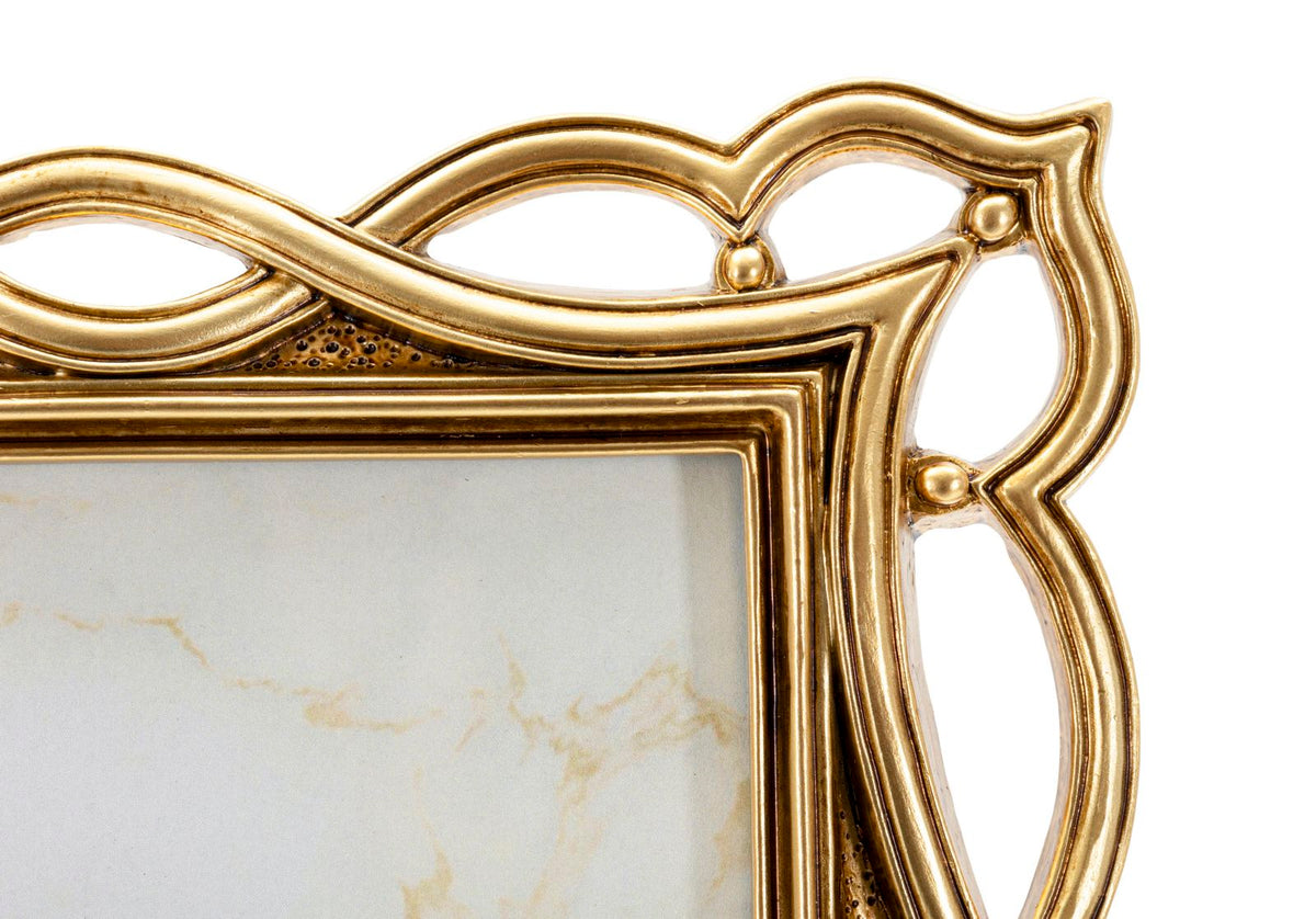 Particolare superiore della Cornice Wave elegante cm 23x1,8x27,9 con finitura oro lucido e struttura decorativa.