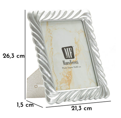 Cornice Carvy Cm 21,3X1,5X26,3 con dimensioni evidenziate e supporto posteriore, ideale per foto 15x20 cm in ambienti domestici o professionali.