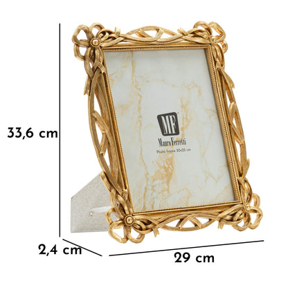 Cornice Knot elegante con misure 29x2,4x33,6 cm e interno 20x25 cm, struttura dorata con supporto da tavolo e design intrecciato.