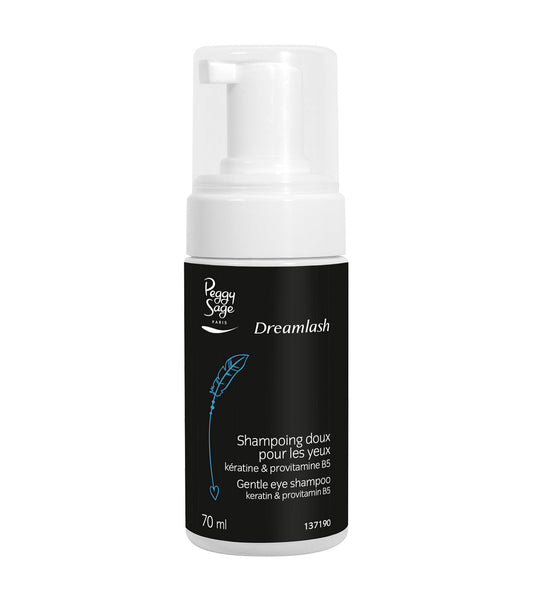 Flacone di shampoo delicato per occhi Peggy Sage Dreamlash, 70 ml, con dispenser a pompa, etichetta nera con scritte bianche e disegno di piuma blu