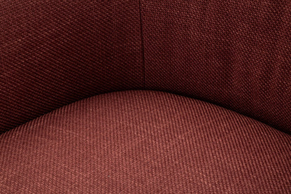 Dettaglio della seduta della Poltrona Girevole Siena Bordeaux con tessuto intrecciato, comfort e qualità.