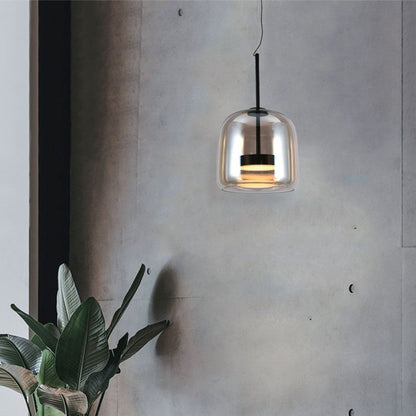 Lampada a sospensione LED in vetro trasparente e metallo nero, design moderno, ideale per illuminare ambienti interni con stile