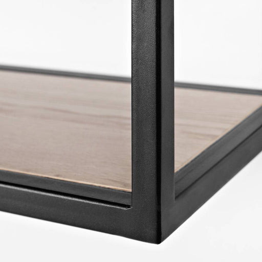 Dettaglio del telaio in metallo nero con ripiano in rovere chiaro, struttura robusta e moderna per arredo casa elegante.