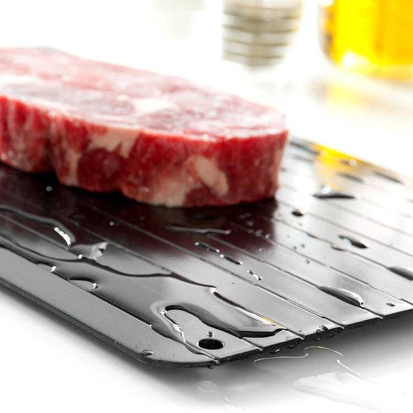 Innovagoods Piastra di Scongelamento Rapido Alimenti - Antiaderente - Stabile - Risparmio Energetico - Lega Metallica - Uso Universale - Pulizia Facile - 35x20.5x1cm - Colore Nero