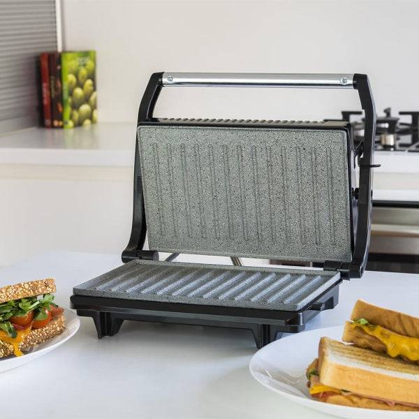 Cecotec rock'n Grill Griglia Elettrica - 700W - Antiaderente - Manico Tocco Freddo - Base Antiscivolo - Vano Gestione Cavi - Superficie Cottura 23x14.5cm - Colore Nero e Argento