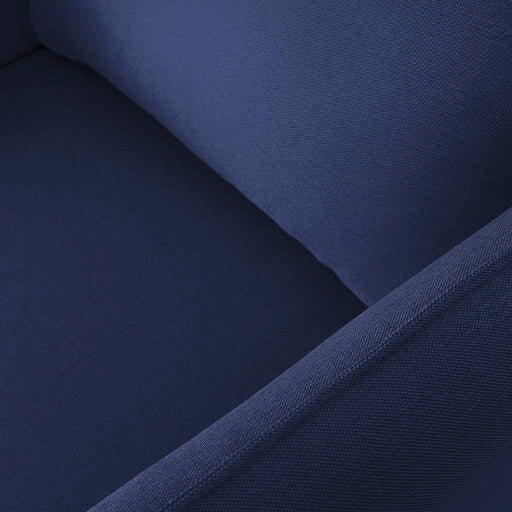 Dettaglio tessuto blu in primo piano, imbottitura morbida e resistente, perfetta per poltrona di design contemporaneo.