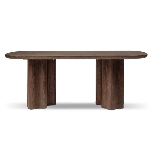 Tavolo da pranzo in legno noce scuro con piano ovale e gambe robuste in MDF, stile elegante e moderno, ideale per sala da pranzo.