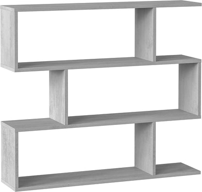 Libreria alta Athena a zig zag colore cemento, design geometrico e contemporaneo, perfetta per arredare ambienti moderni.