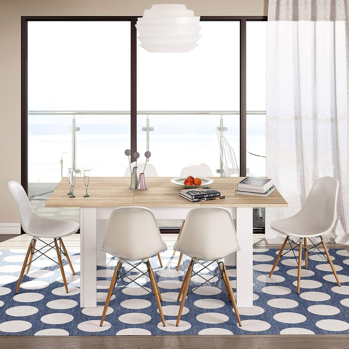 Tavolo allungabile bianco lucido 90x140/190 cm in una sala da pranzo luminosa. Stile nordico con sedie bianche e decorazioni moderne.