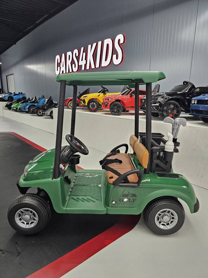 Carrello da golf elettrico per bambini verde con copertura superiore in plastica, volante e sedile in pelle marrone, perfetto per divertimento