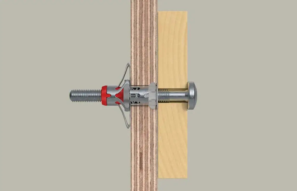 Fissaggio di un pannello di legno con tassello e vite per cartongesso, tassello in metallo con gancio di sicurezza, installato in parete in legno