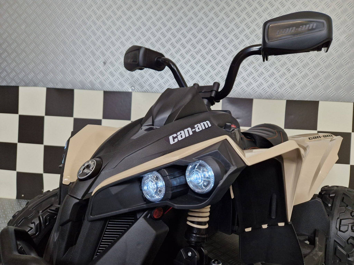 Manubrio del quad elettrico bambini con manopole nere e dettagli di sicurezza, montato su forcella con sospensioni robuste.