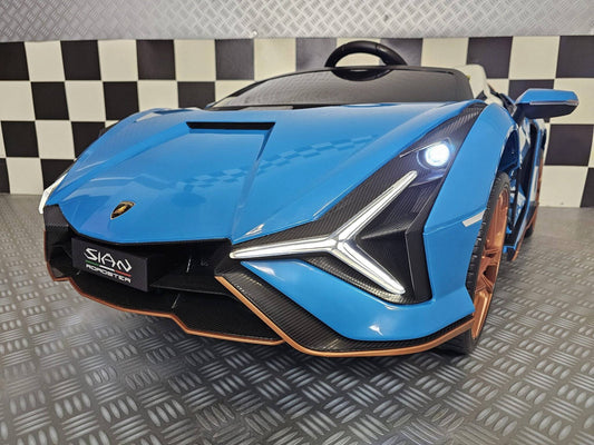 Auto elettrica per bambini Lamborghini Sian 24V blu con dettagli in carbonio, sedili bianchi, ruote in bronzo e design sportivo