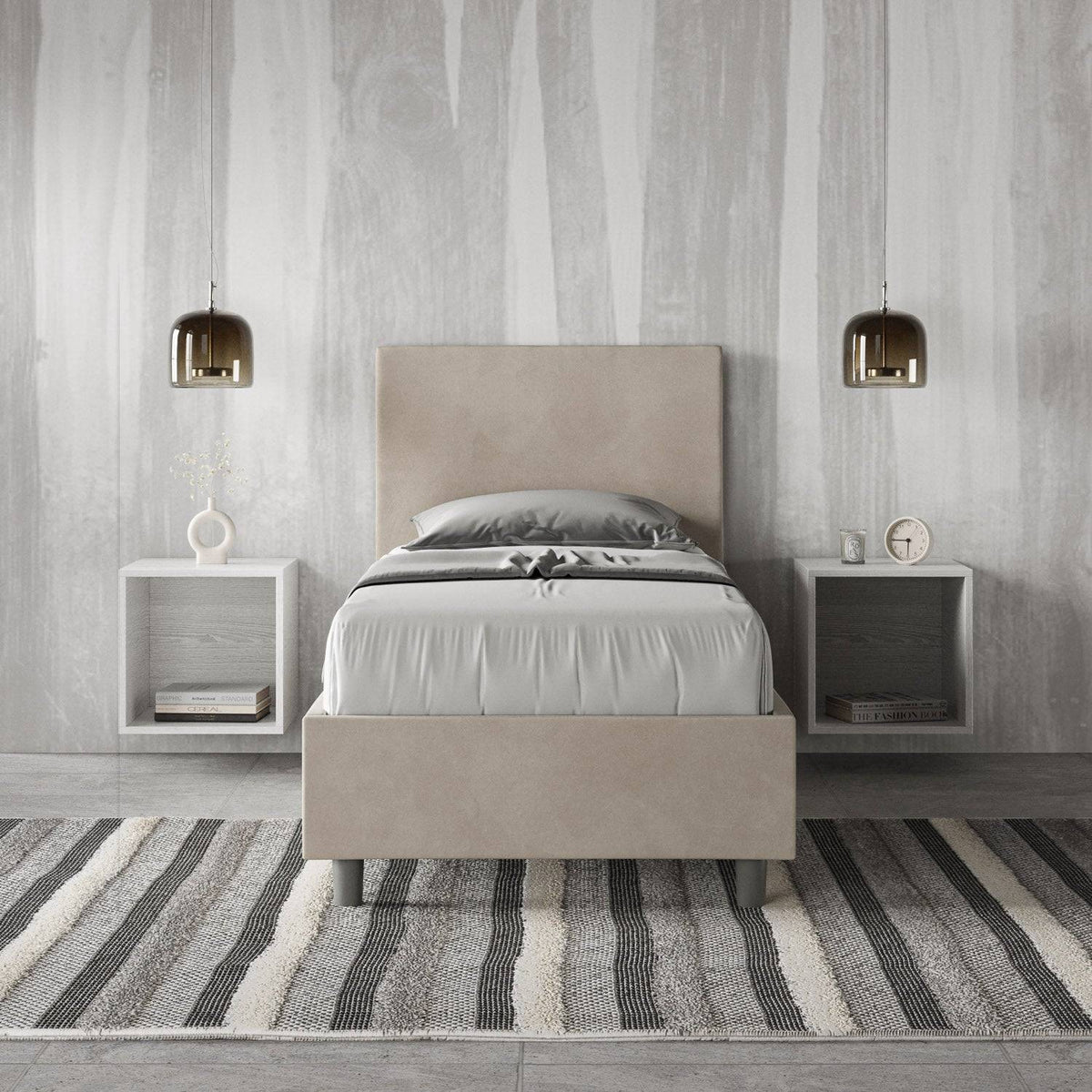 Letto singolo contenitore imbottito 90x200 microfibra Adele beige in camera moderna. Arredo raffinato con comodini sospesi e tappeto a righe.
