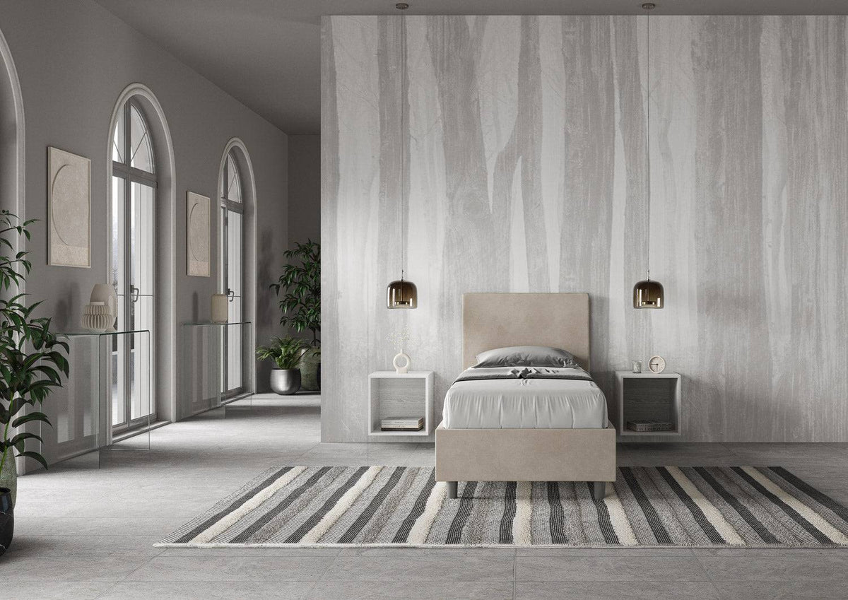 Letto singolo contenitore imbottito 90x200 microfibra Adele beige in ambiente ampio e luminoso. Design sobrio e funzionale per ogni zona notte.