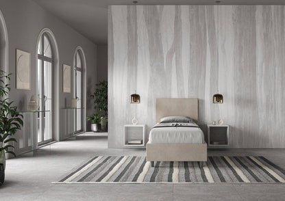 Letto singolo contenitore imbottito 90x200 microfibra Adele beige in ambiente ampio e luminoso. Design sobrio e funzionale per ogni zona notte.
