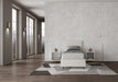 Letto singolo imbottito Adele bianco in similpelle 80x190 cm, perfetto per ambienti luminosi e arredamenti contemporanei.