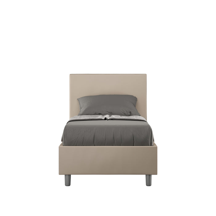 Letto singolo imbottito similpelle Adele beige senza rete, con testiera alta e struttura compatta, adatto a camere moderne.