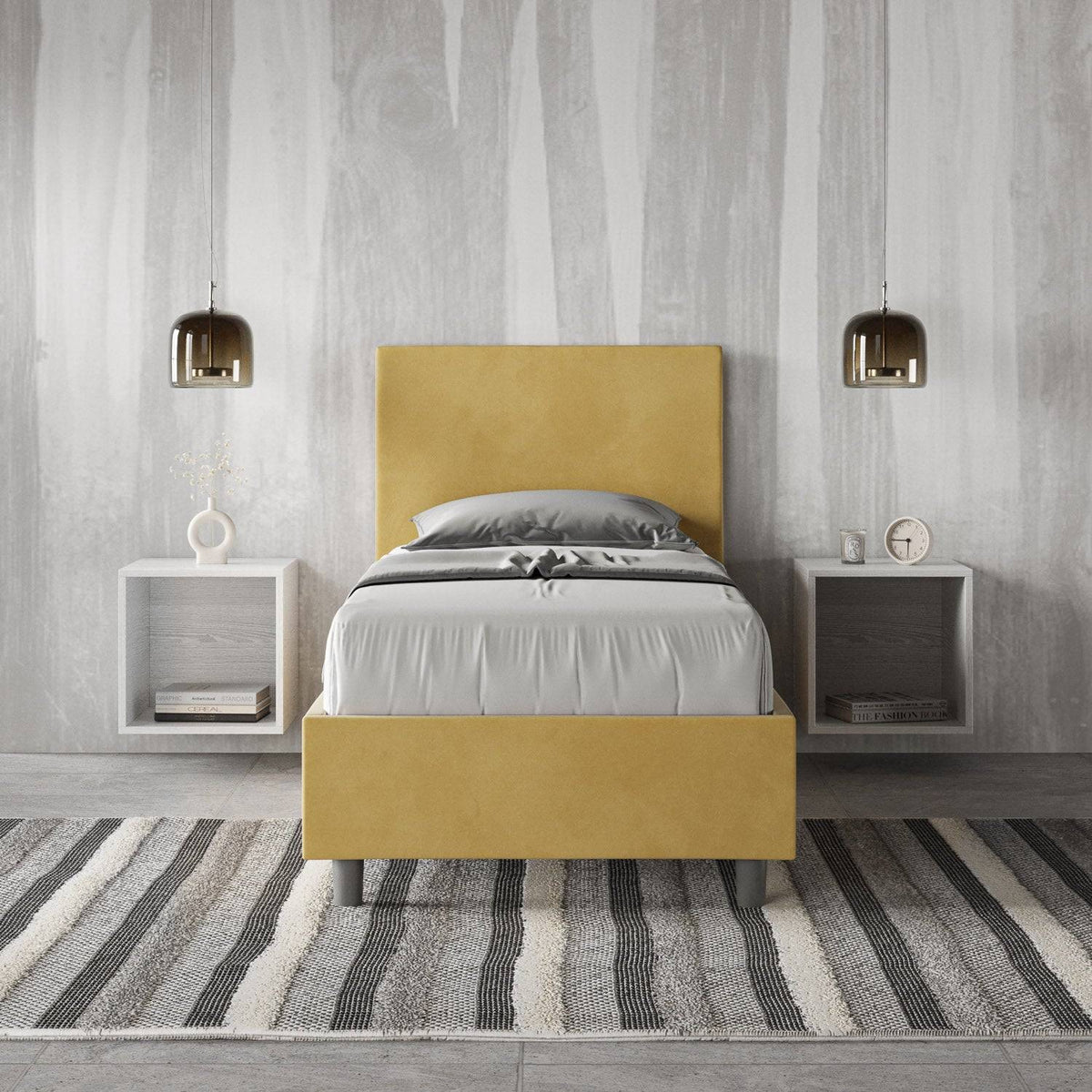 Letto singolo contenitore imbottito 90x200 microfibra Adele giallo senape in camera moderna. Arredo colorato con comodini sospesi e tappeto a righe.
