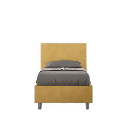 Letto singolo contenitore imbottito 90x200 microfibra Adele giallo senape, con testata alta e piedini grigi. Stile vivace per camere moderne.