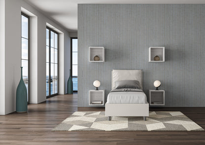 Letto singolo imbottito Antea bianco 80x190 in una stanza luminosa con vista mare, perfetto per ambienti eleganti e funzionali.