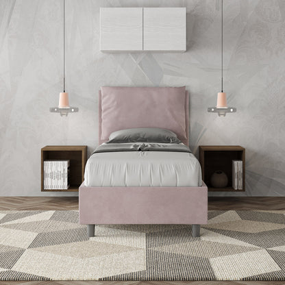Letto singolo Antea 80x190 rosa cipria in microfibra con testiera imbottita, inserito in una camera elegante con arredi sospesi.