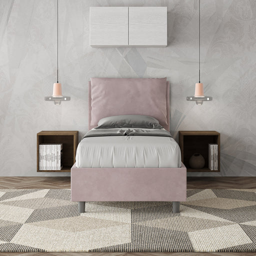 Letto singolo Antea 80x190 rosa cipria in microfibra con testiera imbottita, inserito in una camera elegante con arredi sospesi.