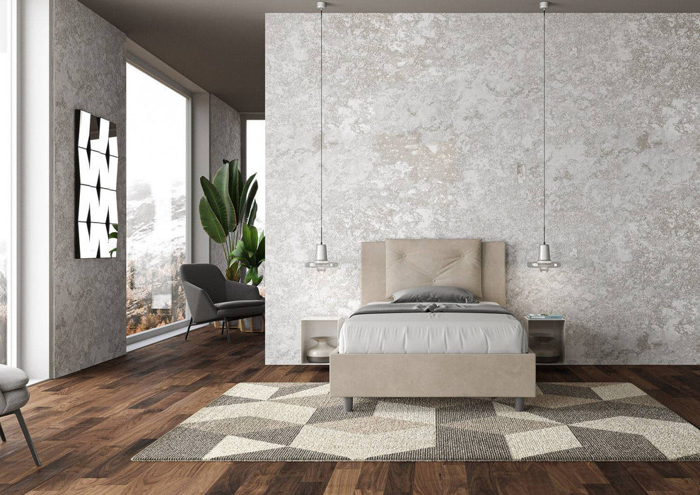 Letto singolo contenitore imbottito 100x200 microfibra Appia beige chiaro, in una stanza moderna con parquet e pareti neutre.
