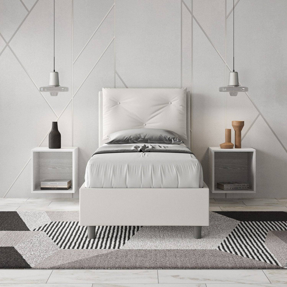 Letto singolo 80x200 in similpelle bianca con testiera trapuntata, inserito in una camera moderna con comodini sospesi.