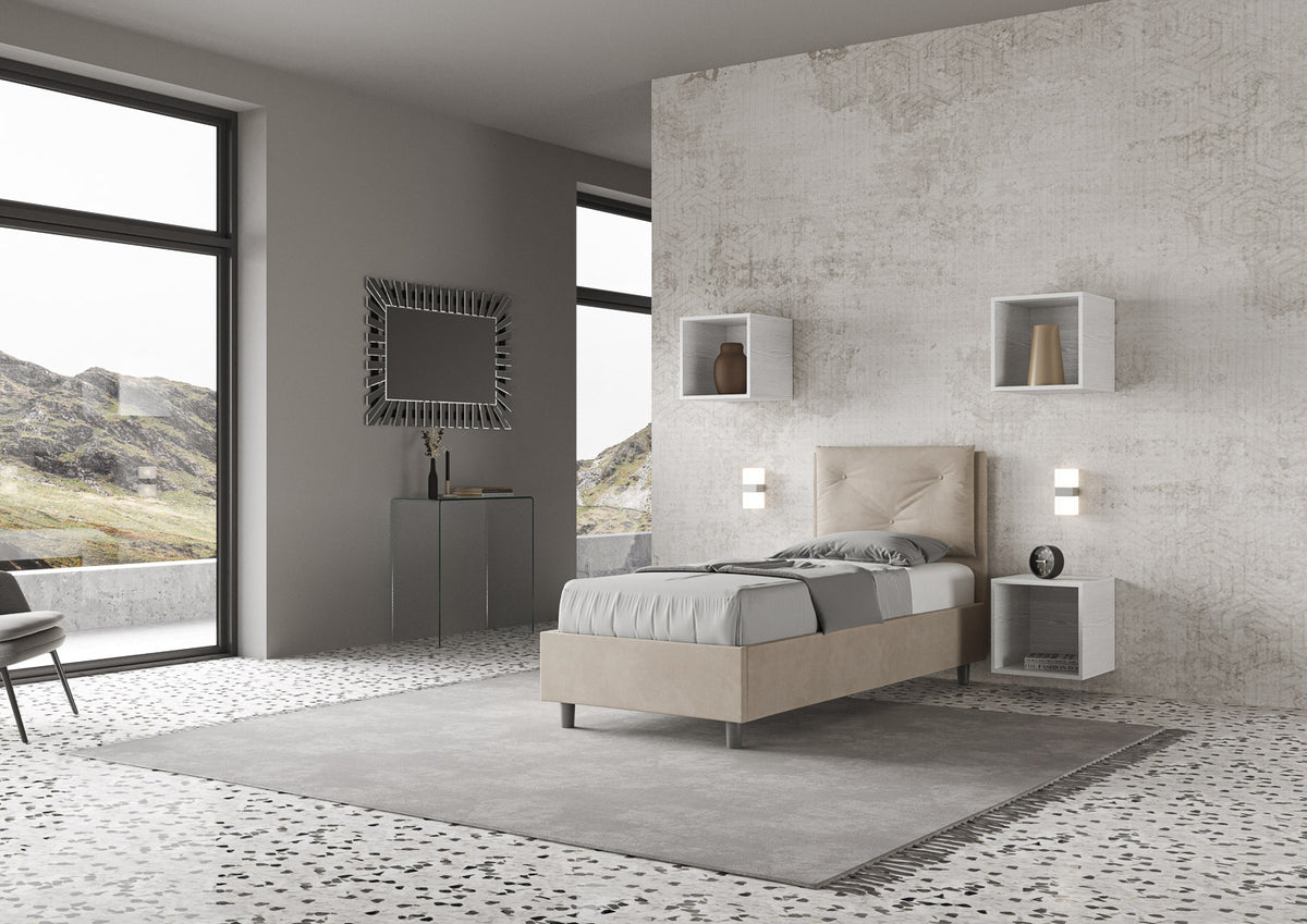 Letto singolo Appia beige tortora 80x190 con struttura imbottita, inserito in una camera moderna con vista panoramica e arredi minimal.