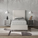 Letto singolo Focus grigio oliva con struttura imbottita e testiera verticale, perfetto per camere luminose e arredamento minimal.