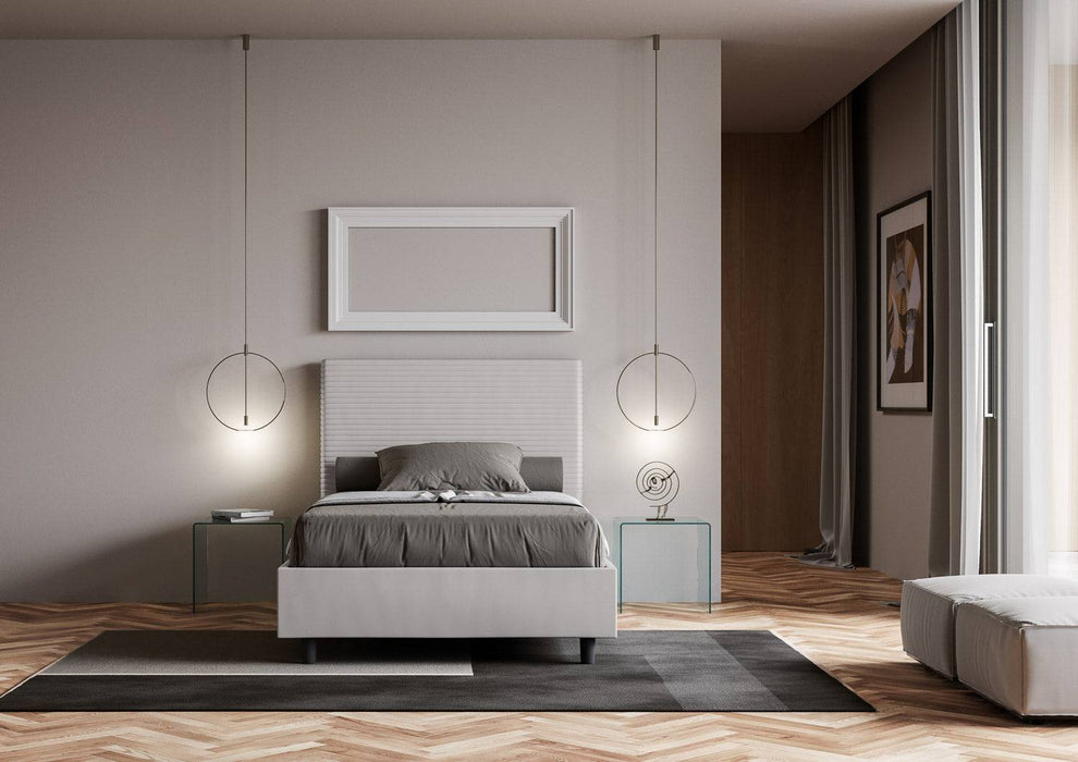Letto singolo contenitore Focus bianco in similpelle, perfetto per arredare camere moderne con stile e funzionalità.