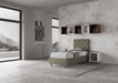 Letto singolo Priya 90x190 con contenitore in similpelle grigia, vista laterale in ambiente luminoso e arredamento moderno