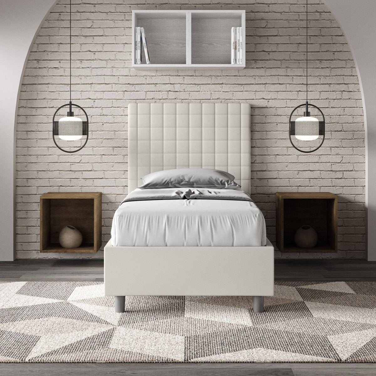 Letto singolo imbottito similpelle Sunny bianco in ambiente moderno con parete in mattoni e comodini a incasso, stile minimalista.