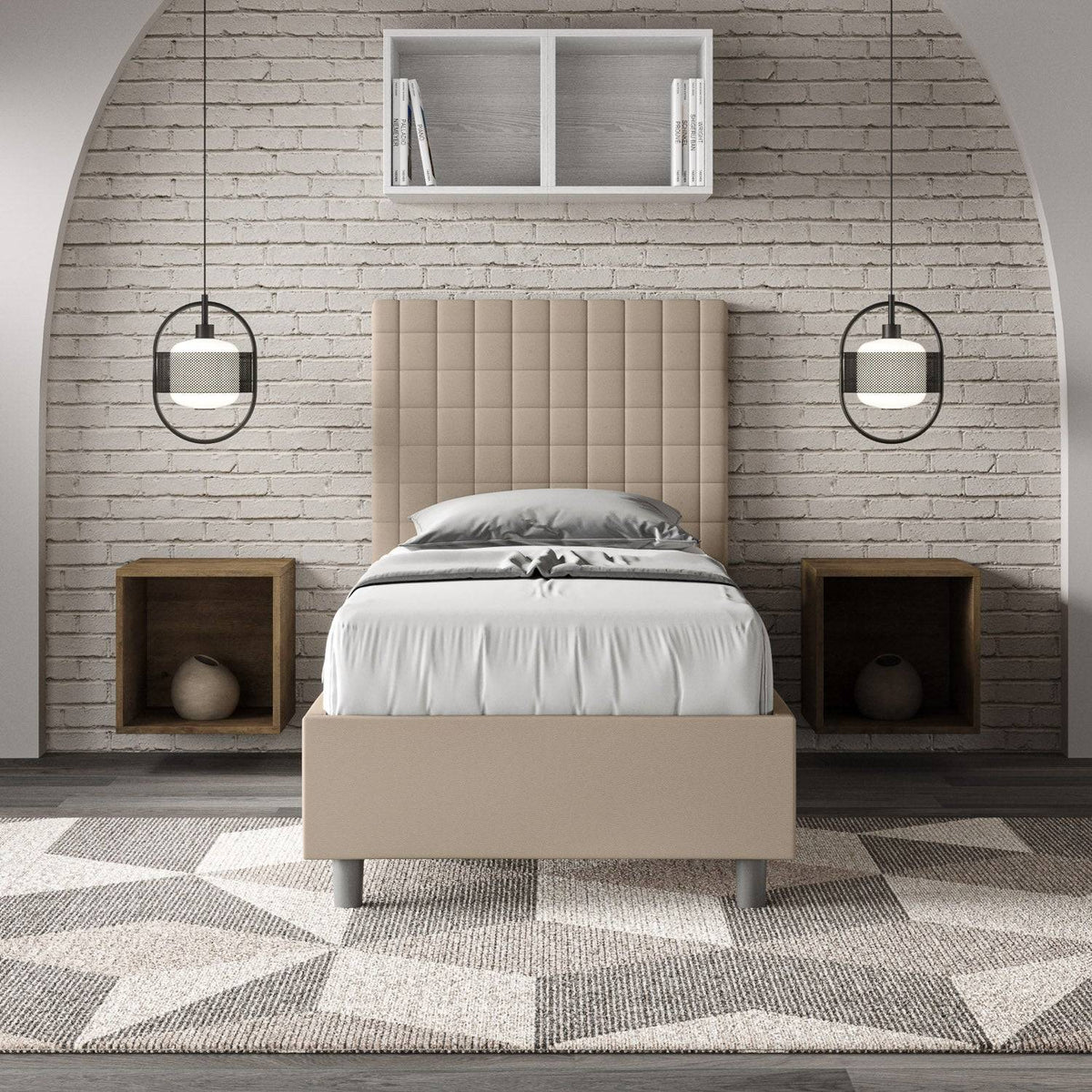 Letto singolo imbottito similpelle Sunny beige in camera moderna con parete in mattoni bianchi e arredamento geometrico.