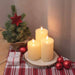 Set di candele LED 3D con fiamma realistica su tavola natalizia