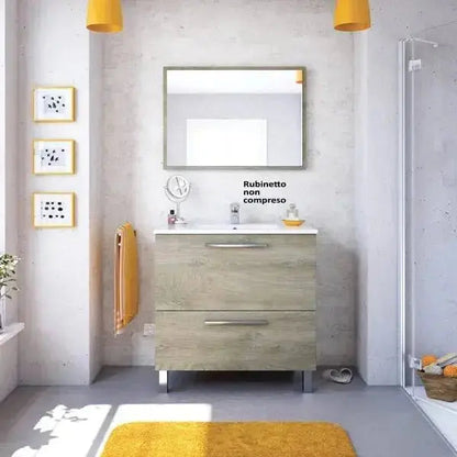 Mobile bagno Vandelia 80x45x80 cm in rovere alaska con specchio, lavello in ceramica e due cassetti, ideale per spazi moderni e compatti.