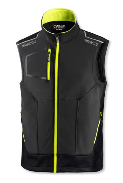 Gilet Tecnico Sparco Illinois nero con inserti rinforzati anti abrasione e dettagli riflettenti, chiusura zip gialla fluorescente.
