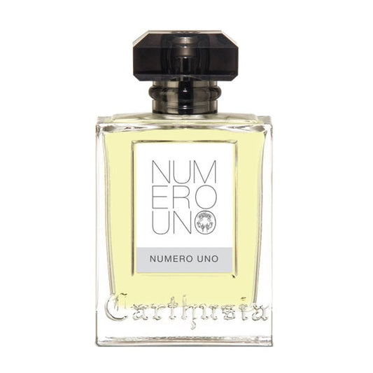 Flacone di profumo Carthusia Numero Uno Eau de Parfum con bottiglia trasparente, etichetta con testo e tappo nero, contenuto giallo chiaro