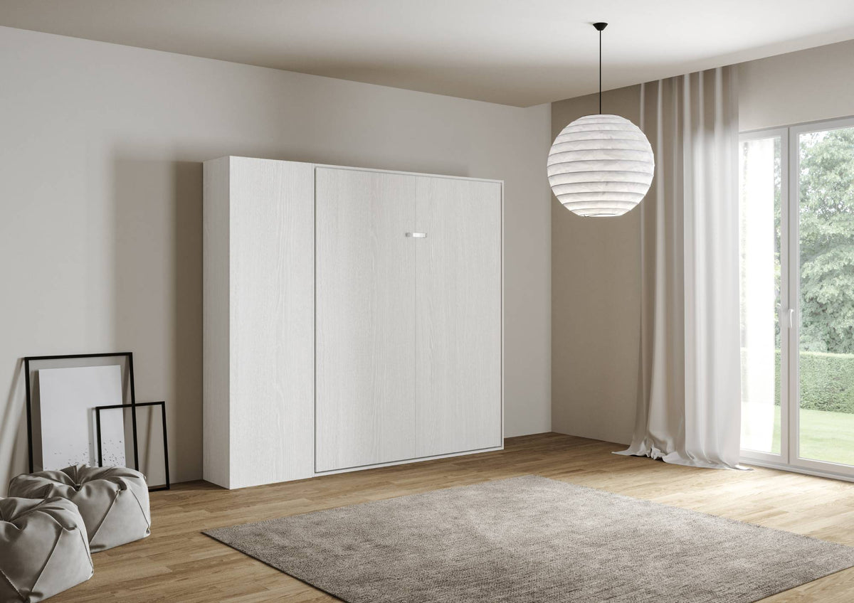 Letto Kentaro bianco con colonna in soggiorno luminoso, perfetto per arredare con funzionalità. Chiusura compatta e design moderno.