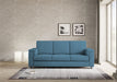 Divano Marrak 3 posti blu in salotto moderno, perfetto per arredare con stile e comfort ambienti contemporanei