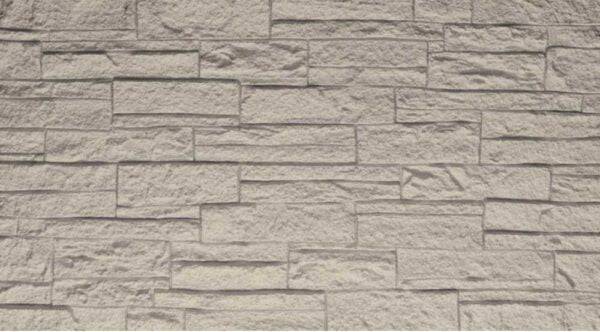 Pannello murale fonoassorbente in PU effetto pietra 3D in tonalità beige chiaro, superficie testurizzata con dettagli di pietra, perfetto per interni eleganti