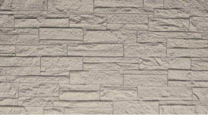 Pannello murale fonoassorbente in PU effetto pietra 3D in tonalità beige chiaro, superficie testurizzata con dettagli di pietra, perfetto per interni eleganti