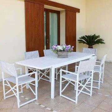 Tavolo Formentera bianco con sei sedie coordinate, ideale per arredare il giardino con eleganza.