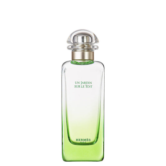 Flacone di profumo Hermes Un Jardin Sur Le Toit con vetro trasparente e sfumature verdi, tappo rotondo in plastica trasparente, elegante e raffinato