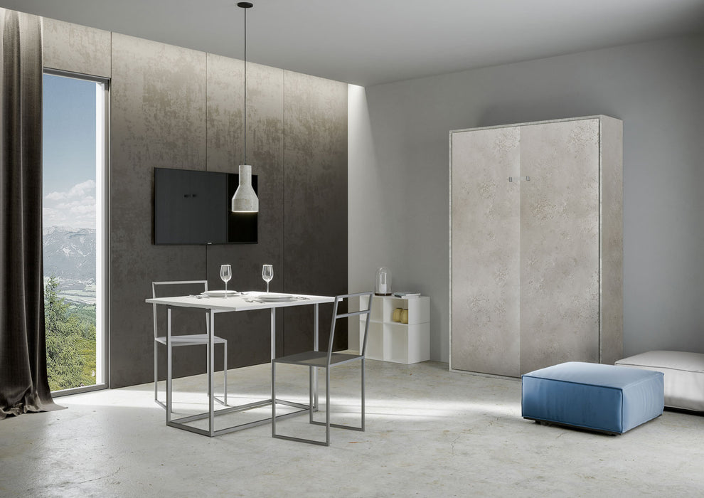 Zona pranzo moderna con letto a scomparsa Kentaro effetto cemento chiuso, ideale per ambienti multifunzionali.