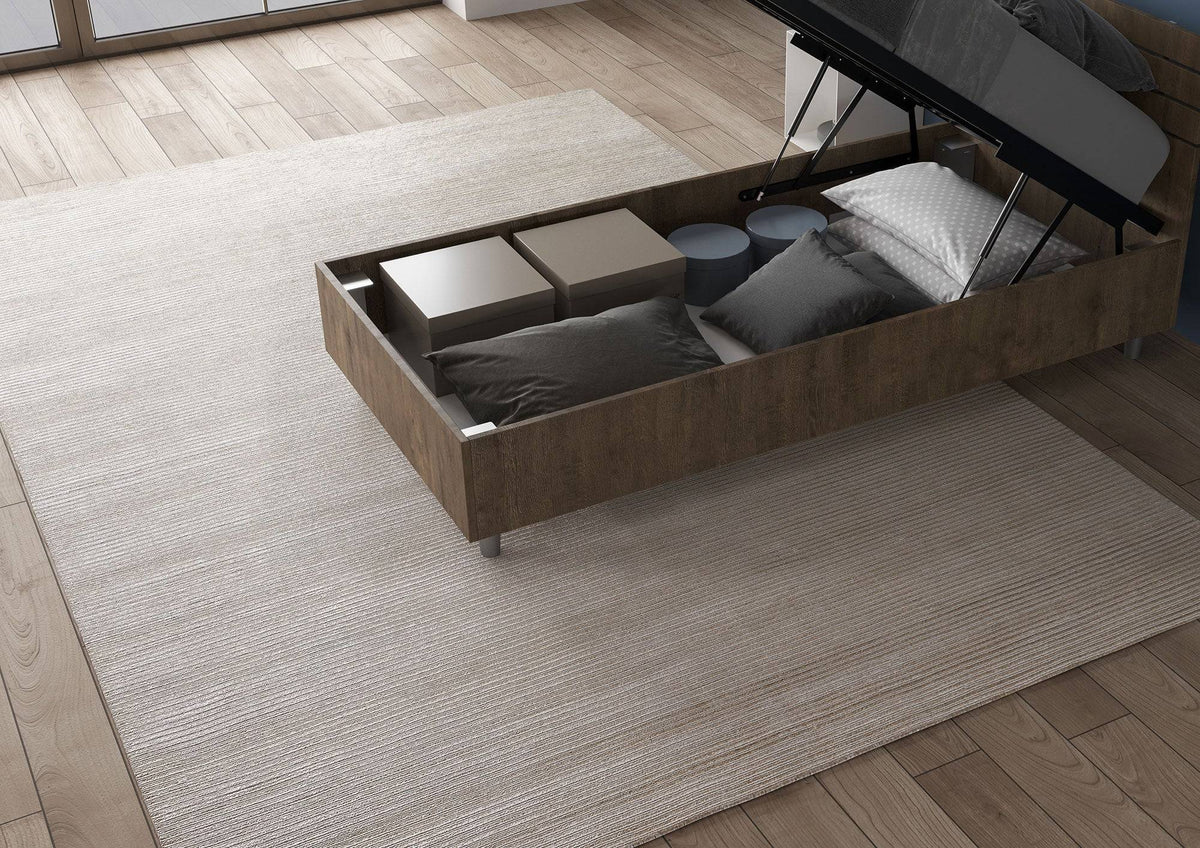 Letto singolo legno scuro Nuamo 80x200 con contenitore aperto, perfetto per organizzare cuscini e accessori.
