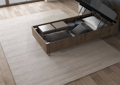 Letto singolo legno scuro Nuamo 80x200 con contenitore aperto, perfetto per organizzare cuscini e accessori.